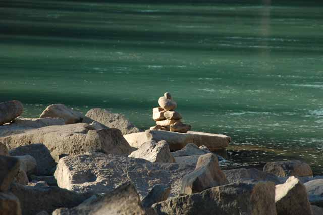a cairn along the banks of the Athabasca River